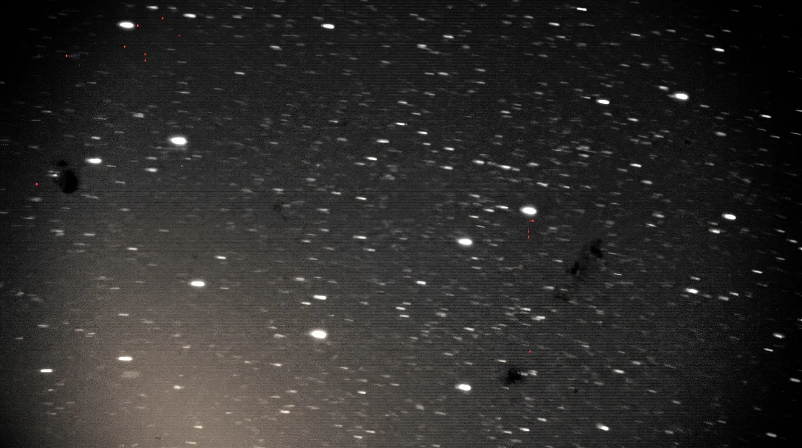 A noisy raw telescope plate resolving into a sharp star field, with detection reticles drawn onto the brighter stars