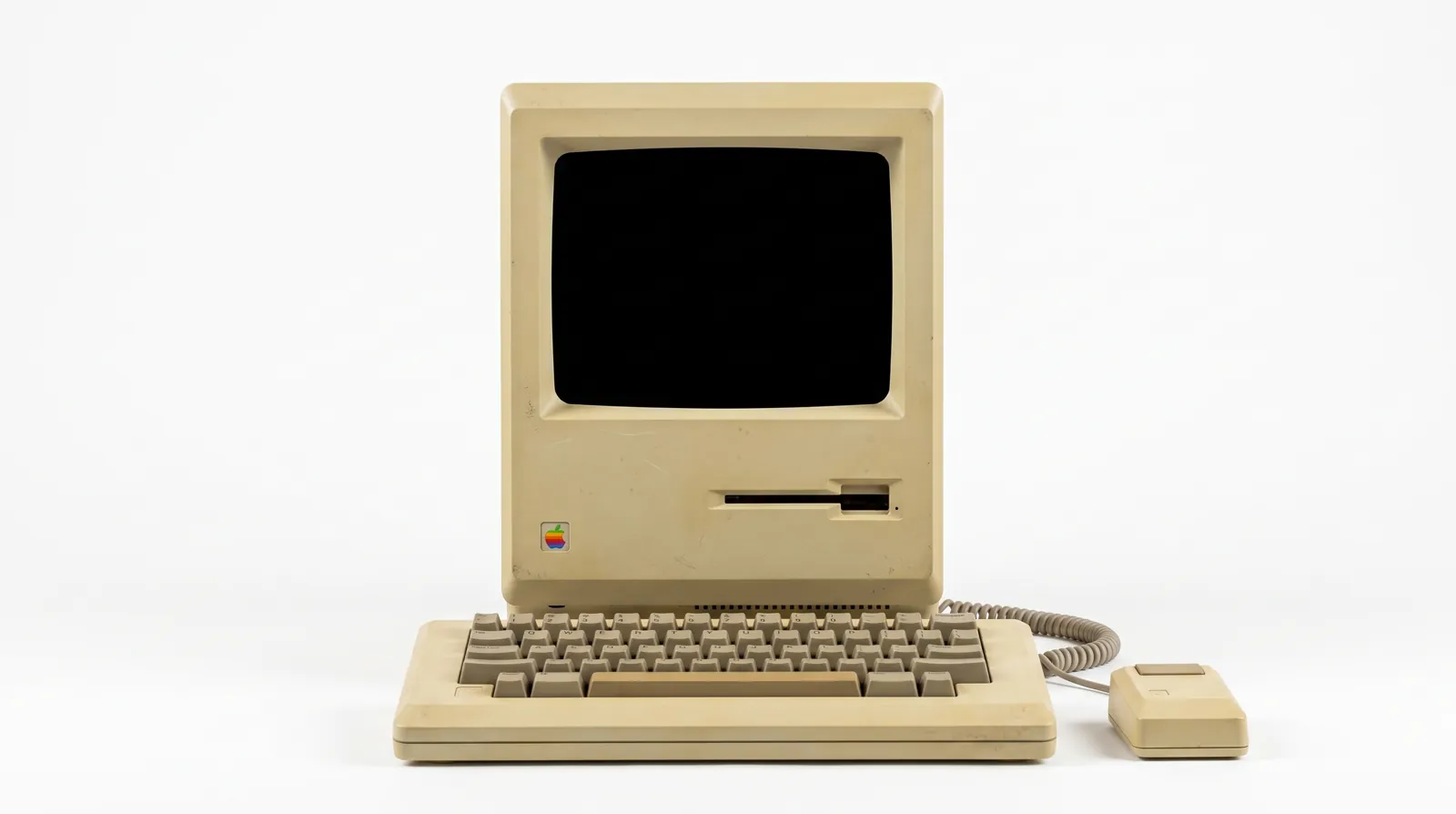 A 1984 Macintosh 128K coming apart and rebuilding itself as a MacBook Pro